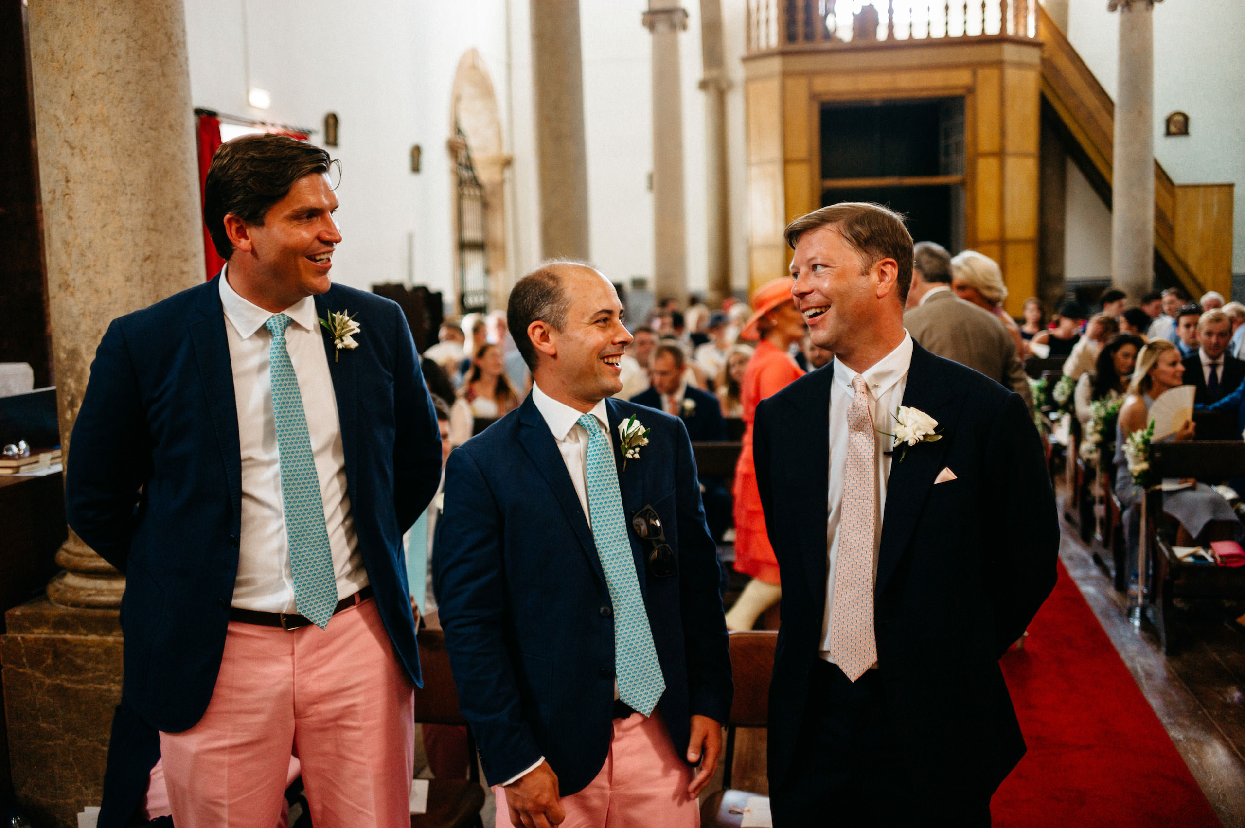 Wedding in Portugal | Caroline & Justin 33 Justin and his groomsmen smiling inside the church in Estoi
